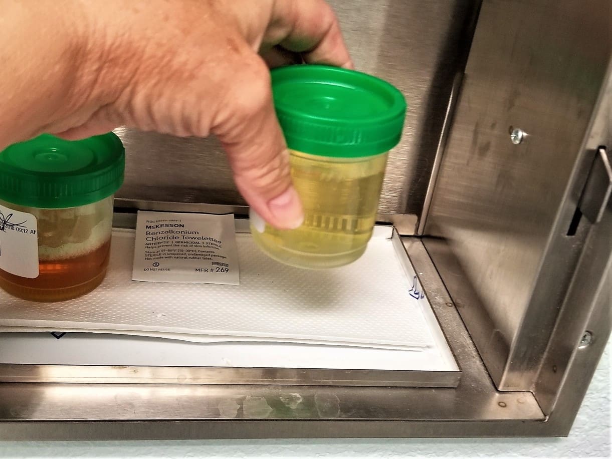 healthcare worker handling pee